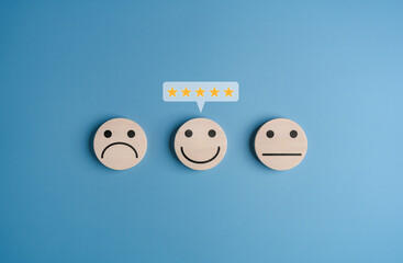 Customer service rating experience feedback emotion and satisfaction survey concept. Wooden labels...
