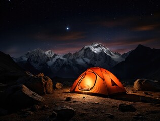 Tent pitched up in the mountains at night
