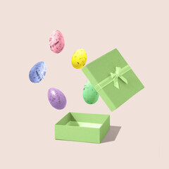 Easter eggs flying in the air out of the box on bright background. Creative Easter idea, greeting card. 