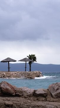 Beautiful cinematic water splashes. Powerful waves crashing the coast of Njivice, Croatia one day after Storm Ciar&aacute;n smashed into Krk Island. Birds flying above the disquiet sea surface.