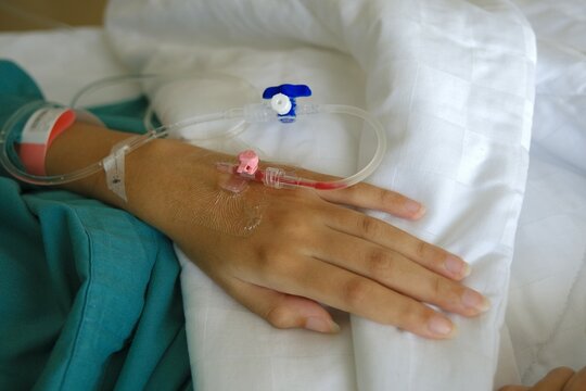 A needle that is placed in the patient's hand for infusion flow. IV drip transfusion