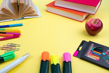 Back to school. Stationery on a yellow table. Office desk with copy space. Flat lay.