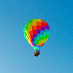 Majestic Colorful Hot Air Balloon Soaring High in a Clear Blue Sky