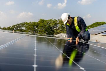 Engineer service check installation solar cell on the roof of factory. Engineers walking on roof inspect and check solar cell panel. Engineer working inspection installation solar cell on the roof