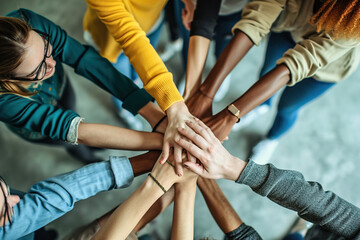 Team-building outings or events, many hands clasped together.