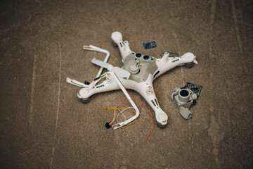 Fallen damaged quadcopter drone crash on a floor. - 767211446