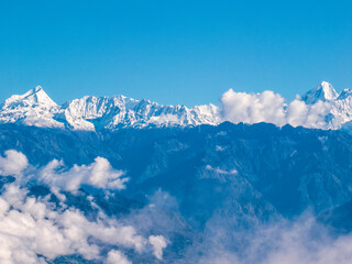Aerial view of the peaks of Himalaya from Nagarkot, Nepal. A sea of clouds and Himalayan peaks towering out