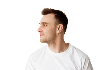 Young man with short hair and stubble turned his head to side showing off his chin and cheekbones against white studio background. Concept of natural beauty, spa treatments, masculine, cosmetology.