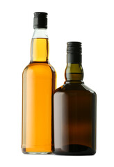 Different sorts of whiskey in glass bottles isolated on white