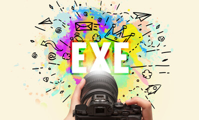 Close-up of a hand holding digital camera with abstract drawing