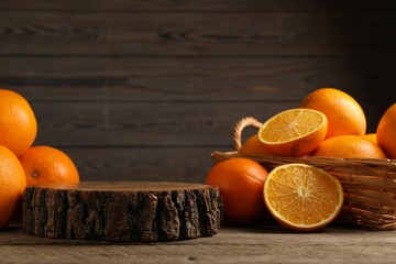 Fresh oranges on wooden table, space for text
