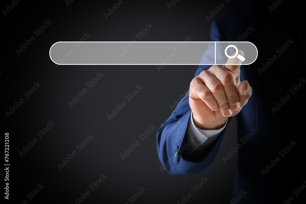 Poster man pointing at search bar on virtual screen against dark background, closeup