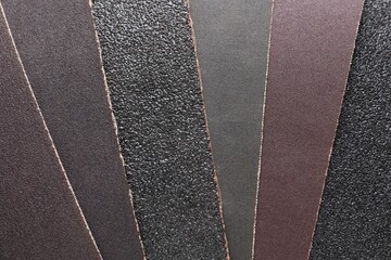 Many sheets of sandpaper as background, top view - obrazy, fototapety, plakaty