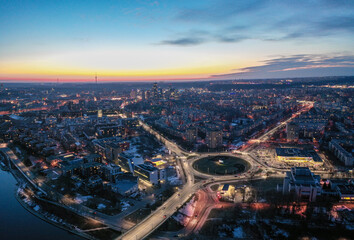 Night Zirmunai District in Vilnius City, Lithuania. Morning Traffic. Autumn Leaves Color. Morning Golden Hour Light.
