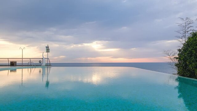 Timelapse shot of the empty swimming pool with Black sea background, cloudy rainy sky above still sea, The coast of Tsikhisdziri at sunset