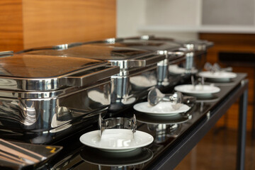 Row of closed chafing dishes