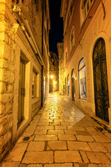 Amazing night view with the beautiful medieval architecture of the old town of Shibenik on the coast of the Adriatic Sea, Croatia.