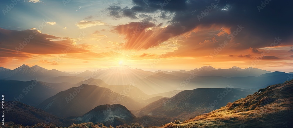 Poster A mountain range with a sunset in the background