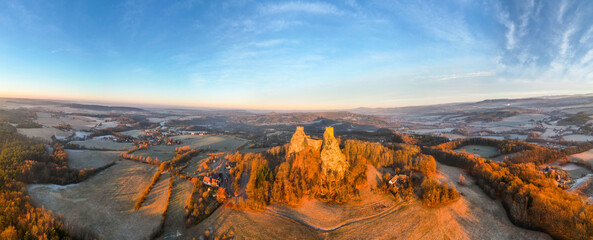 Trosky medieval castle ruins at cold morning sunrise time. Bohemian Paradise, Czech: Cesky raj, Czechia. Aerial view from above. - obrazy, fototapety, plakaty
