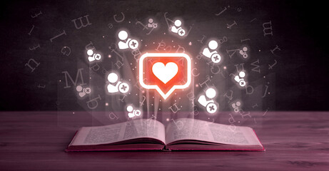 Open book with social networking icons above - 767240264
