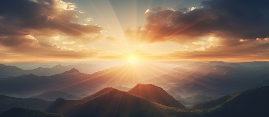 Sun setting over a mountain range