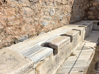 Ancient public Toilet bathroom seats on Ephesus , public toilets used in ancient times, sitting...