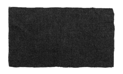 A piece of torn black fabric on a white background. Dark isolate.material for sewing clothes