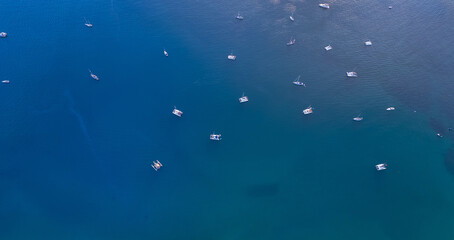 Aerial view white yachts stands in azure transparent water sea, beach Blue Lagoon Comino Malta
