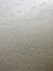 Textured colored plaster, can be used for the background. It has a pronounced structure