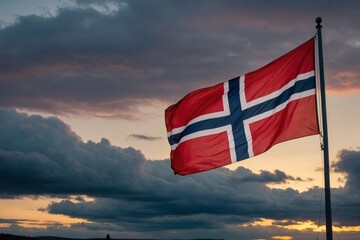 Flag of norway against moody sky with setting sun