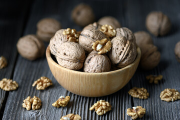 Walnut nuts and kernels on wooden table close up. Food photography