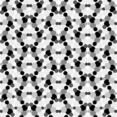 Seamless vector pattern with black and white polka dots in an unusual patterned interpretation
