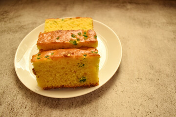 Closeup picture of a tasty fruit cake with colorful plum