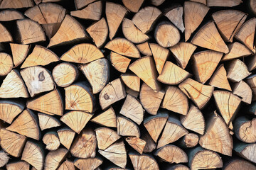 Split hardwood firewood stacked in a row to dry. Dry firewoods texture - 767271056