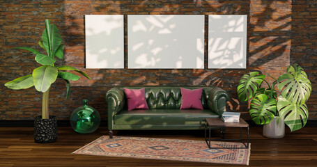 Three white pictures on the brick wall behind an English leather sofa.