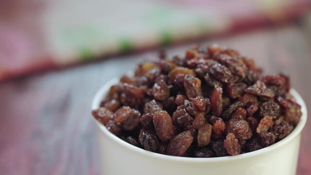 Grab handful of raisins from bowl