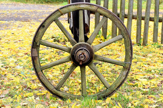 Antique wooden cart wheel in the village