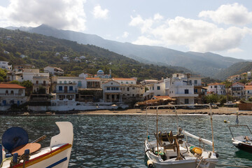 Fishing boats at the cozy harbor of the coastal village of Karavostamo, Ikaria island, Greece