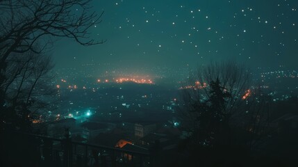 Night view of the city from the top of the mountain in the fog