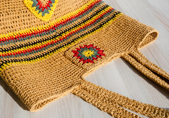 Women's eco bag made of raffia. - obrazy, fototapety, plakaty