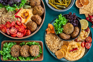 Falafel balls with lettuce and salad in the plate . Fried chickpea balls parsley 