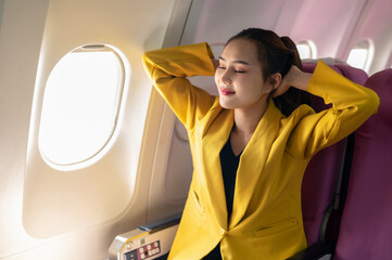 Relaxed Woman Enjoying Flight in Yellow Blazer