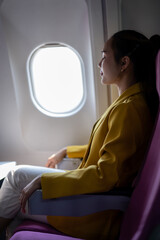 Contemplative Woman Gazing Out Airplane Window
