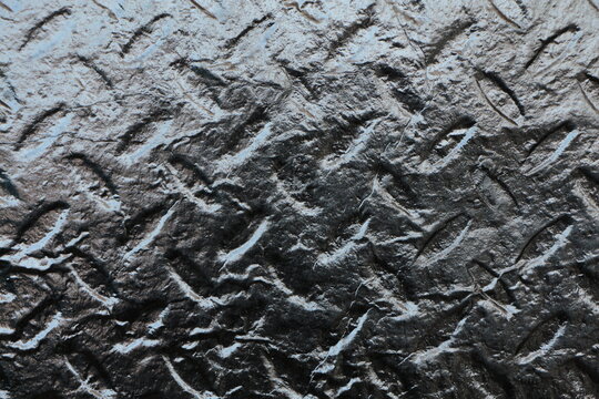 Metallic texture. Black grey diamond metal plate background, grunge polished texture of dark metallic sheet. detail of a metal or aluminum sheet surface