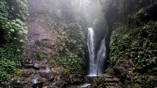 Tripod shot of Git Git waterfall on cloudy day. Gitgit, Bali, Indonesia.