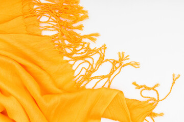 Autumn cozy composition. Yellow scarf on white background. Fall concept. Flat lay, top view, copy...
