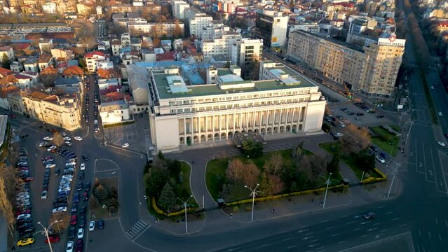 Aerial drone shot of Piața Victoriei in Bucharest - Romania. High angle footage of the infamous square in the capital of Romania with Victoria Palace and the Secretariat General of the government.
