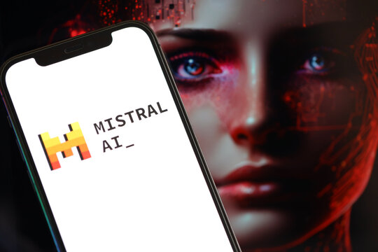 KYIV, UKRAINE - MARCH 17, 2024 Mistral AI logo on iPhone display screen with background of artificial intelligence futuristic ai generated image close up