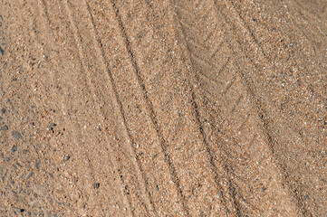 gravel road with big wheel marks, background