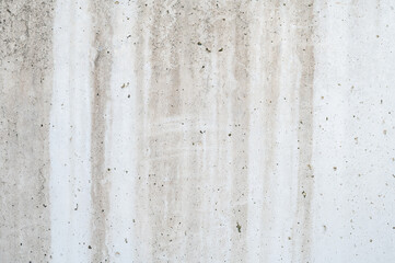 gray and white cement wall with imperfections, construction material, background
